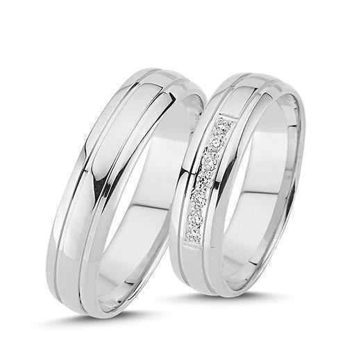 Raffinerede Nuran vielsesringe i 14 karat hvidguld med 0,07 ct diamanter – klassisk design med sten på damering.